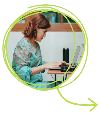 Woman working at a computer seriously